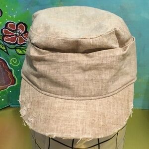Distressed Beige colored newsboy hat